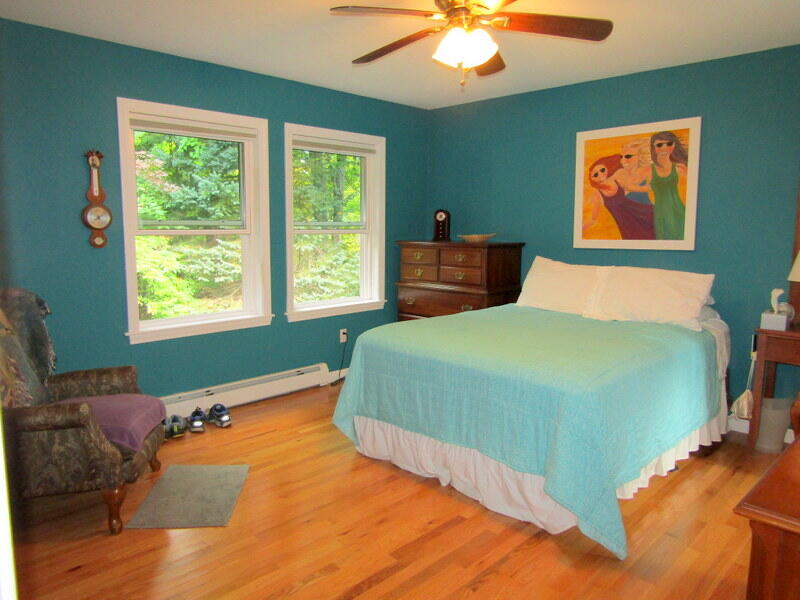 106 Cross Road Minot, ME 04258 - Photo 10 of 51 7. Primary bedroom with hardwood floorin