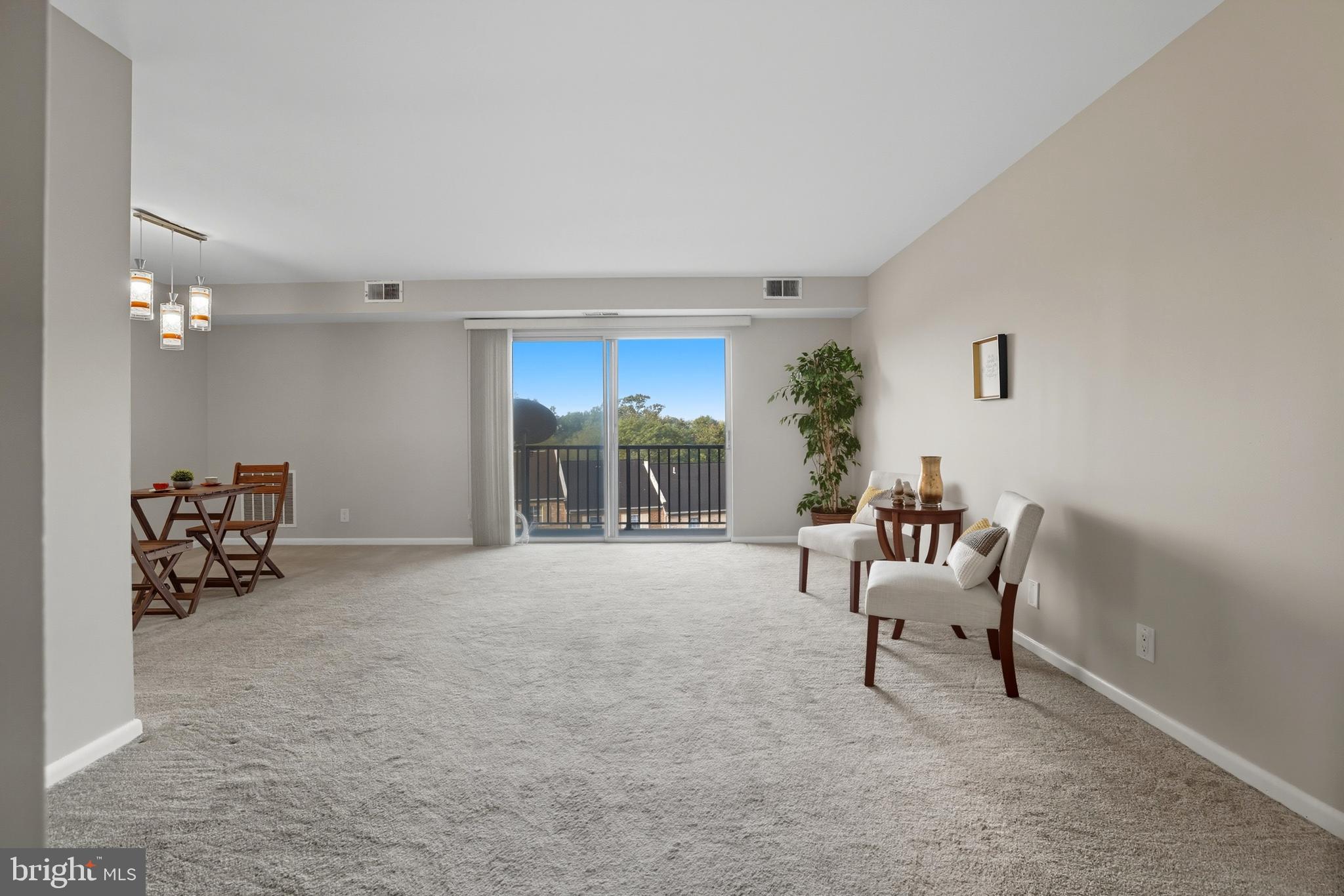 12001 Old Columbia Pike, Unit 508 Silver Spring, MD 20904 - Photo 3 of 22 a view of a livingroom with furniture and a window