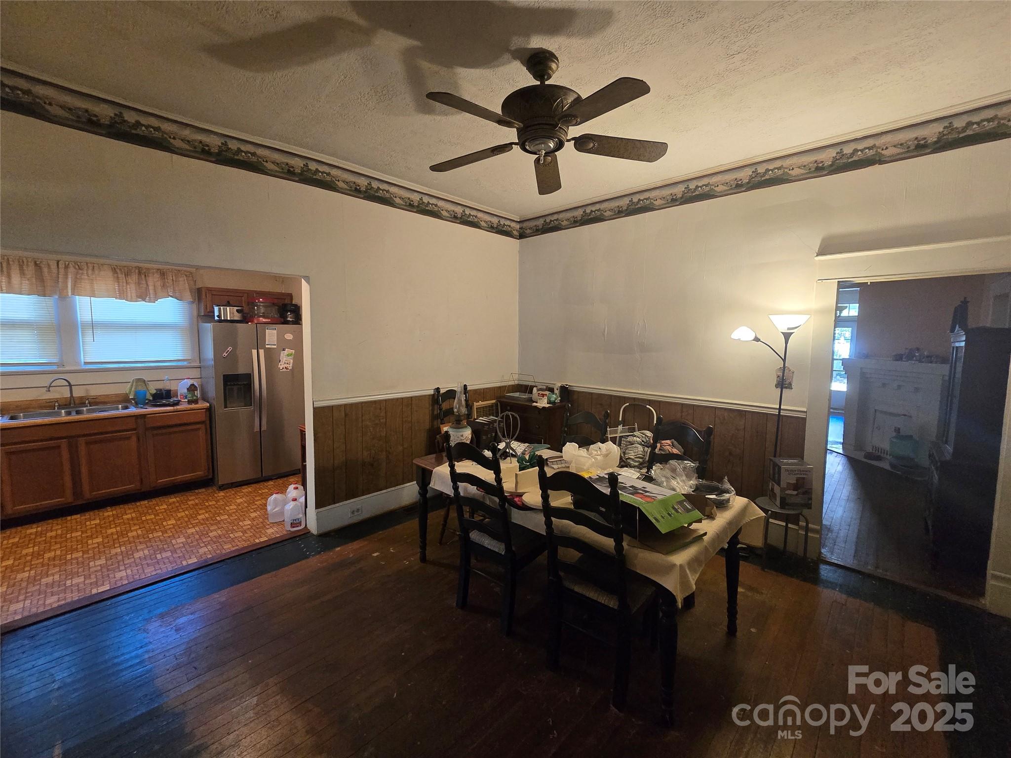 509 5th Street, Unit 5 Spencer, NC 28159 - Photo 12 of 20 a kitchen with stainless steel appliances kitchen island granite countertop a refrigerator and a stove top oven