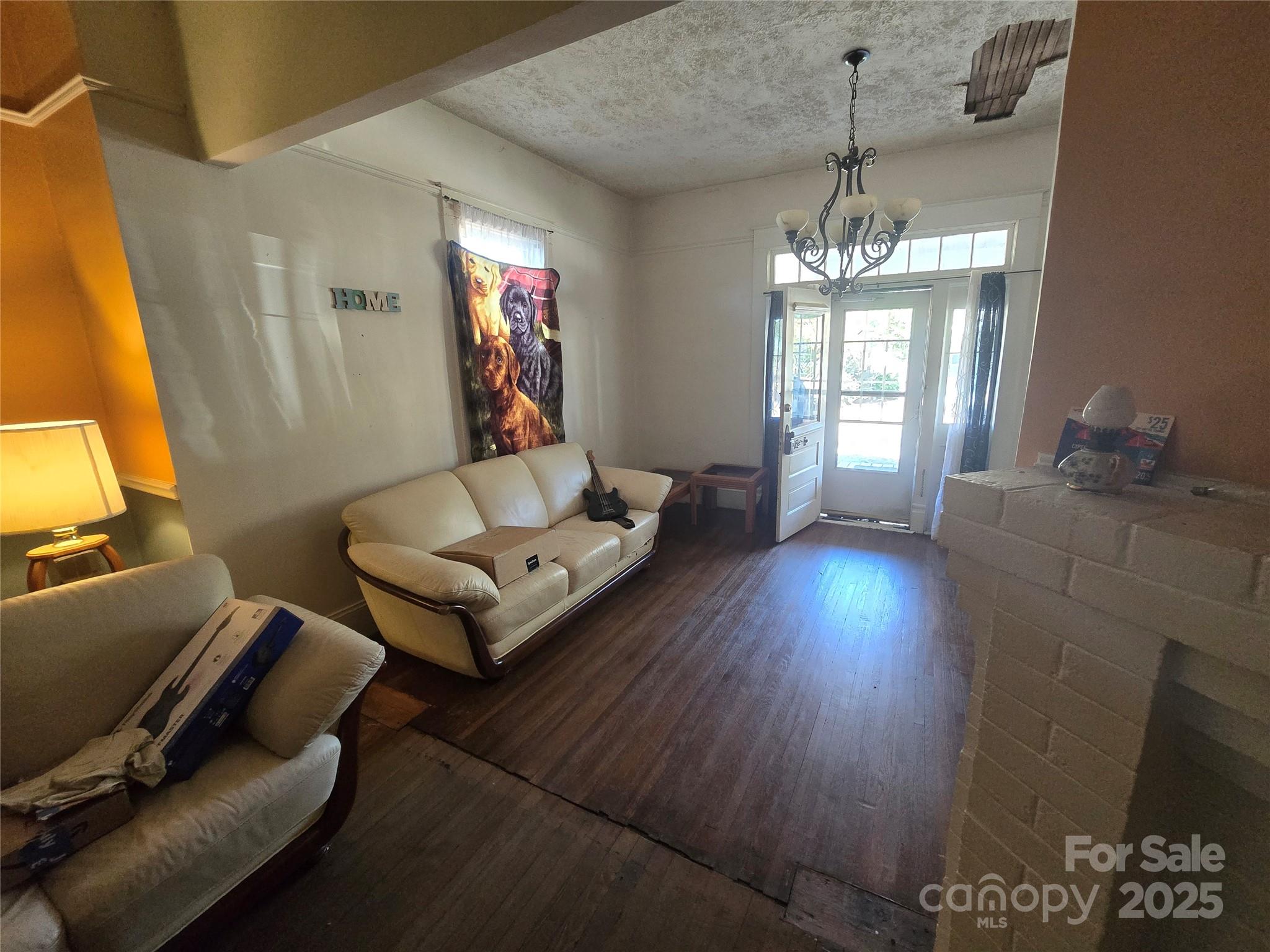 509 5th Street, Unit 5 Spencer, NC 28159 - Photo 17 of 20 a living room with furniture and a chandelier