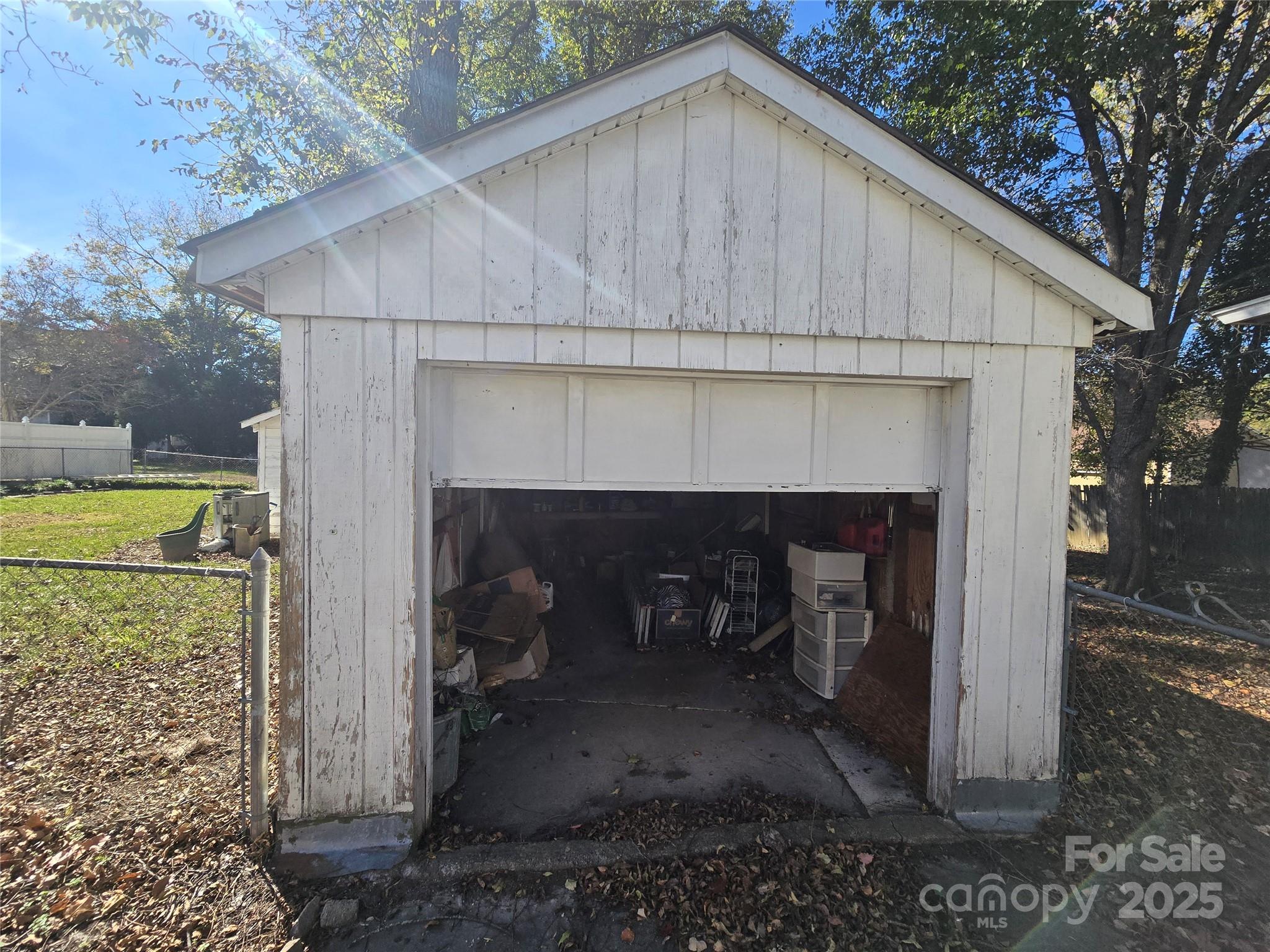 509 5th Street, Unit 5 Spencer, NC 28159 - Photo 4 of 20 a backyard of a house with yard and garage
