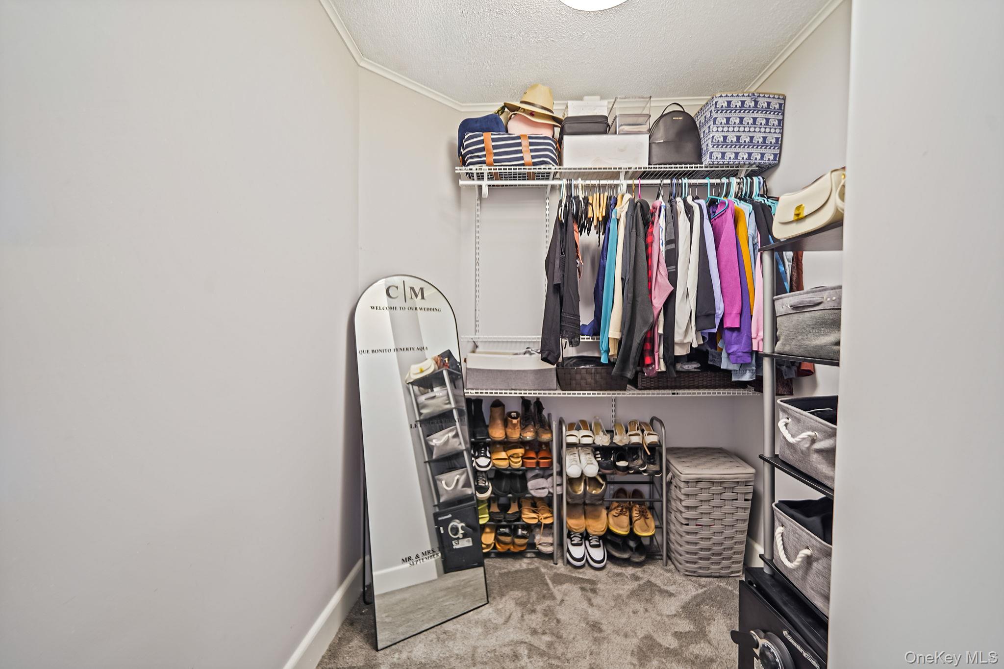 45 Maple Avenue Patchogue, NY 11772 - Photo 11 of 30 a view of walk in closet with clothes and shoes