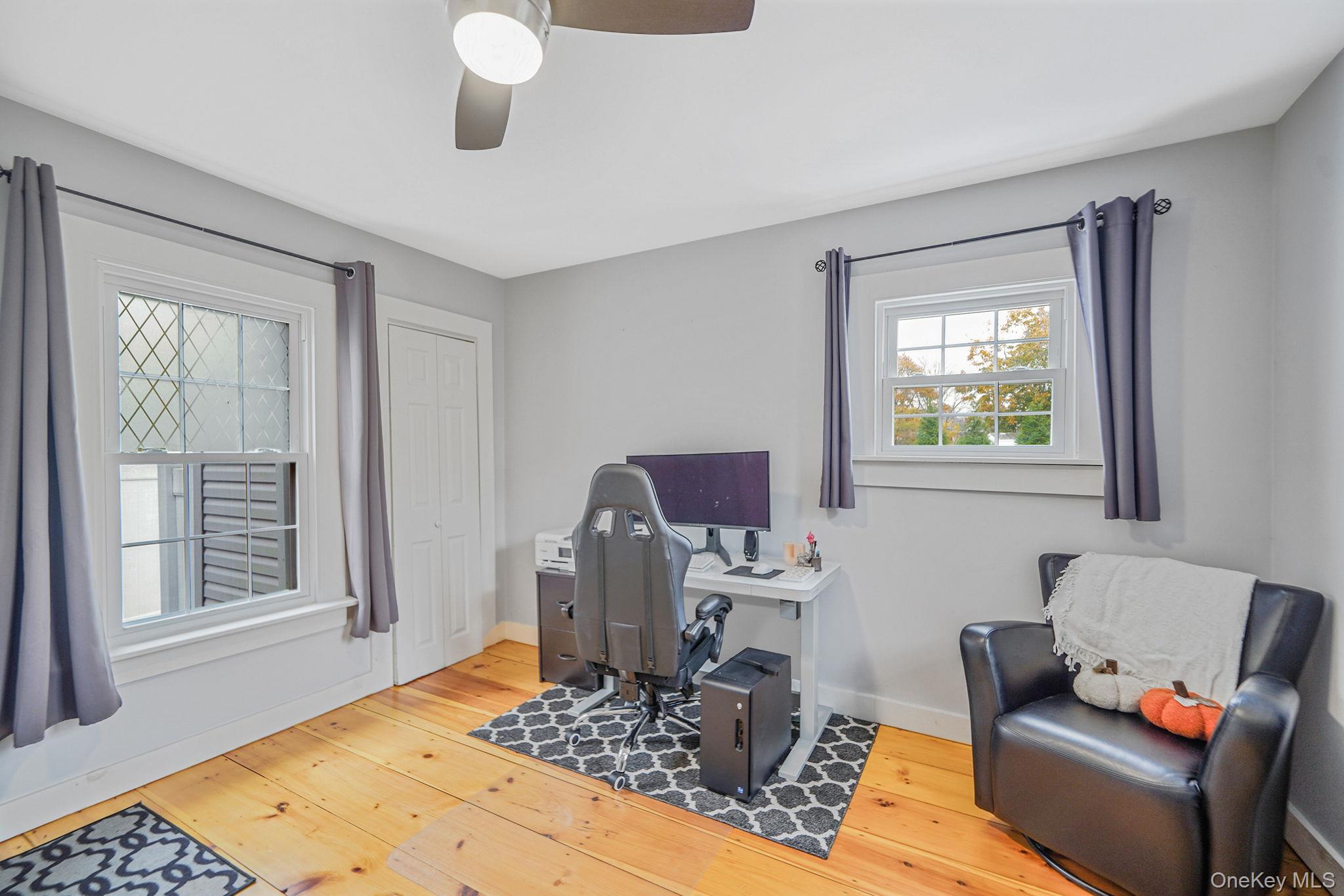 45 Maple Avenue Patchogue, NY 11772 - Photo 13 of 30 a living room with furniture and a window