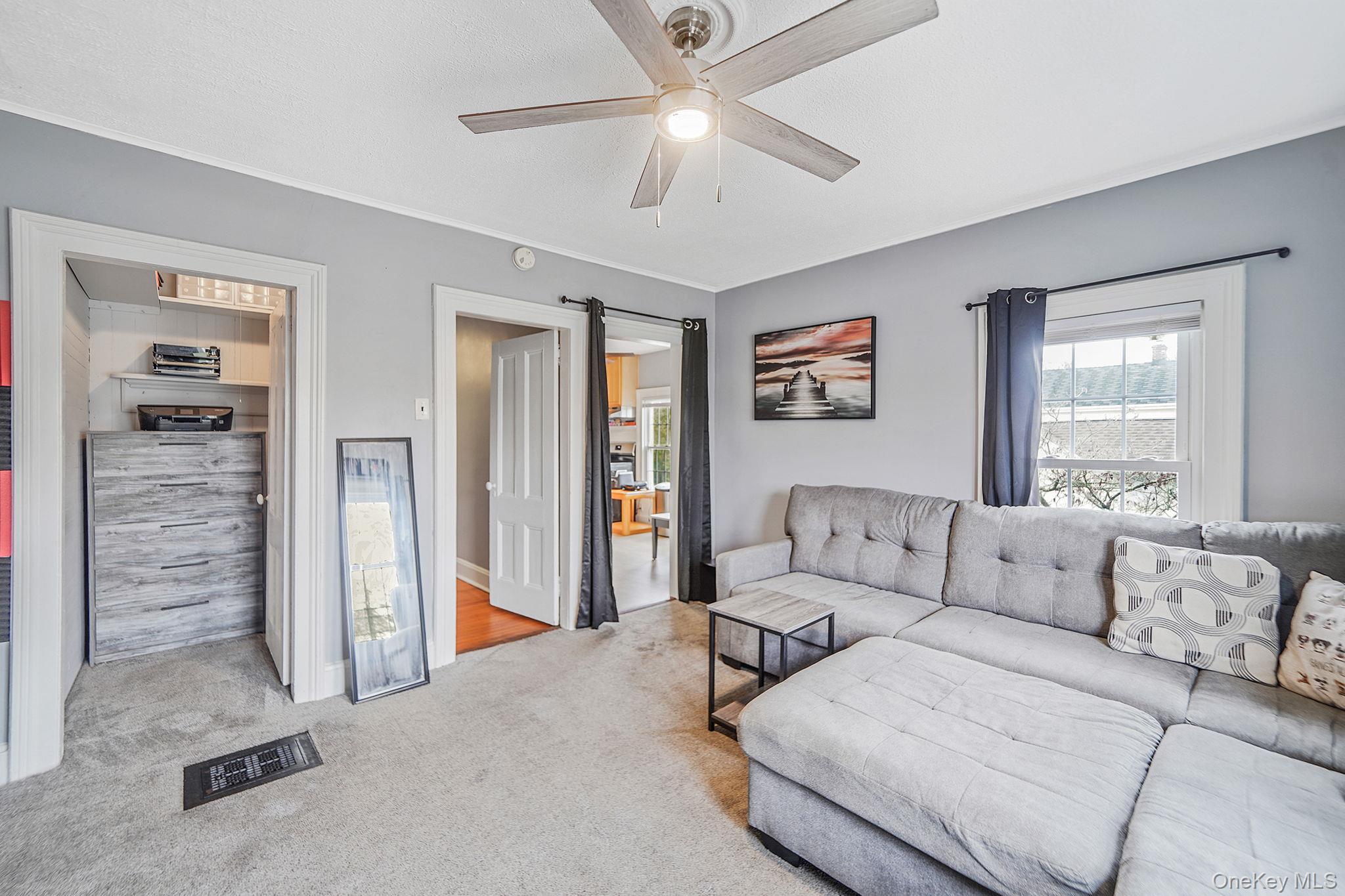 45 Maple Avenue Patchogue, NY 11772 - Photo 20 of 30 a living room with furniture and a couch