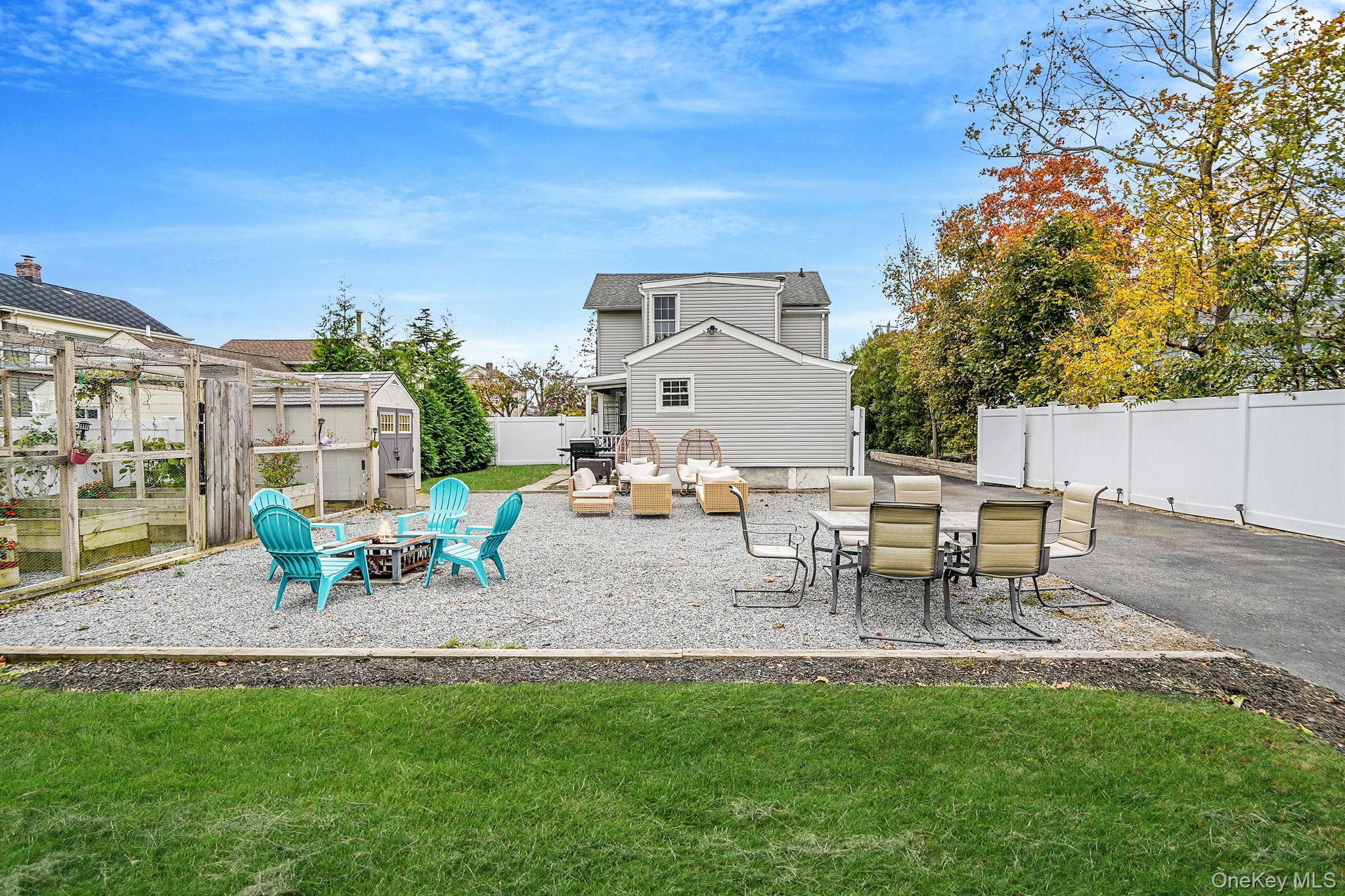 45 Maple Avenue Patchogue, NY 11772 - Photo 25 of 30 a view of outdoor space yard deck patio and fire pit