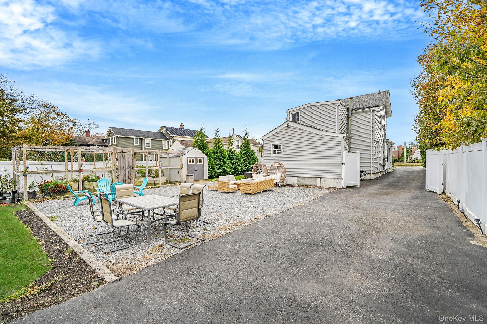 45 Maple Avenue Patchogue, NY 11772 - Photo 26 of 30 a view of a terrace with sitting area