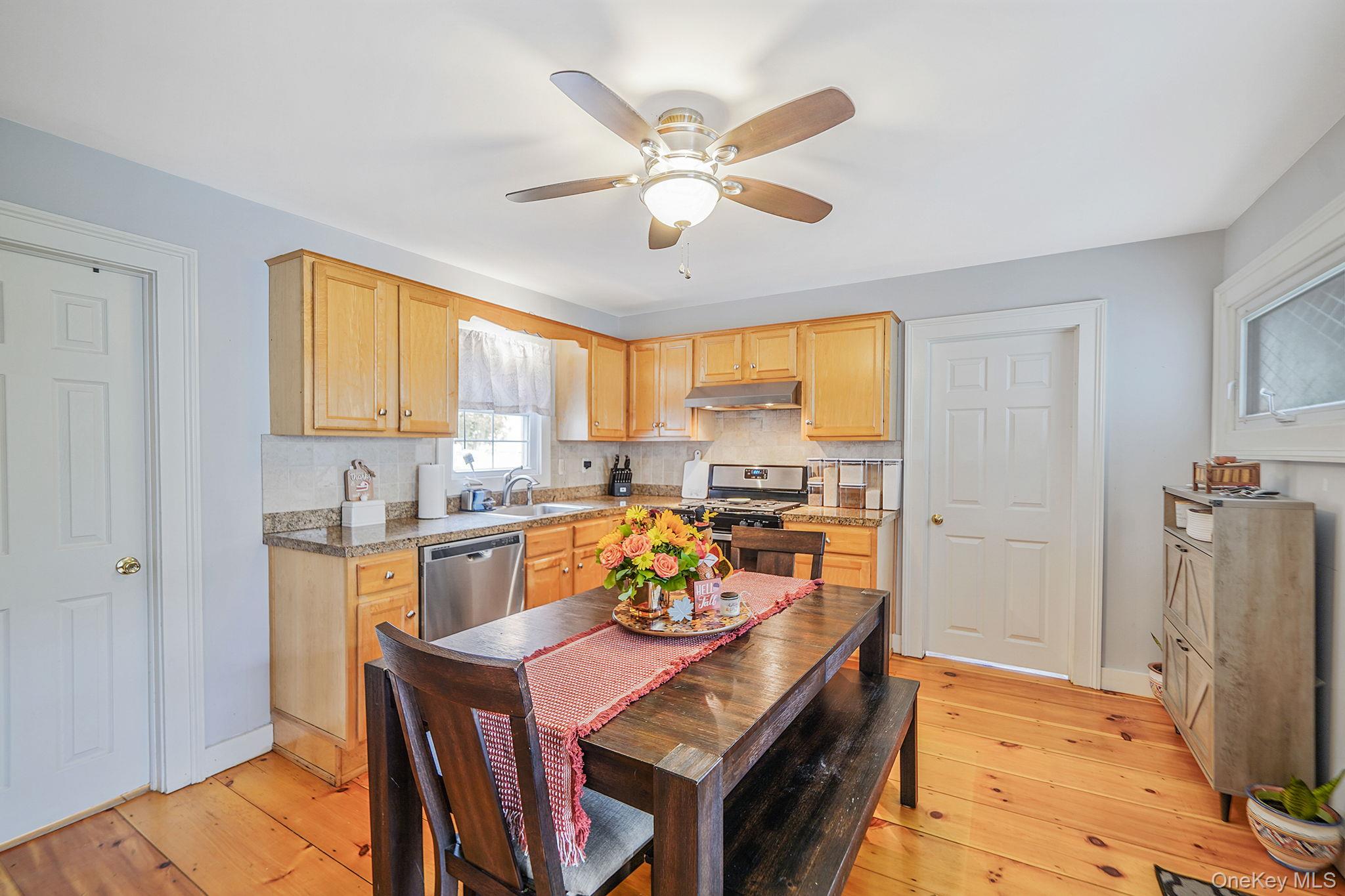 45 Maple Avenue Patchogue, NY 11772 - Photo 6 of 30 a view of a dining room with furniture and a window