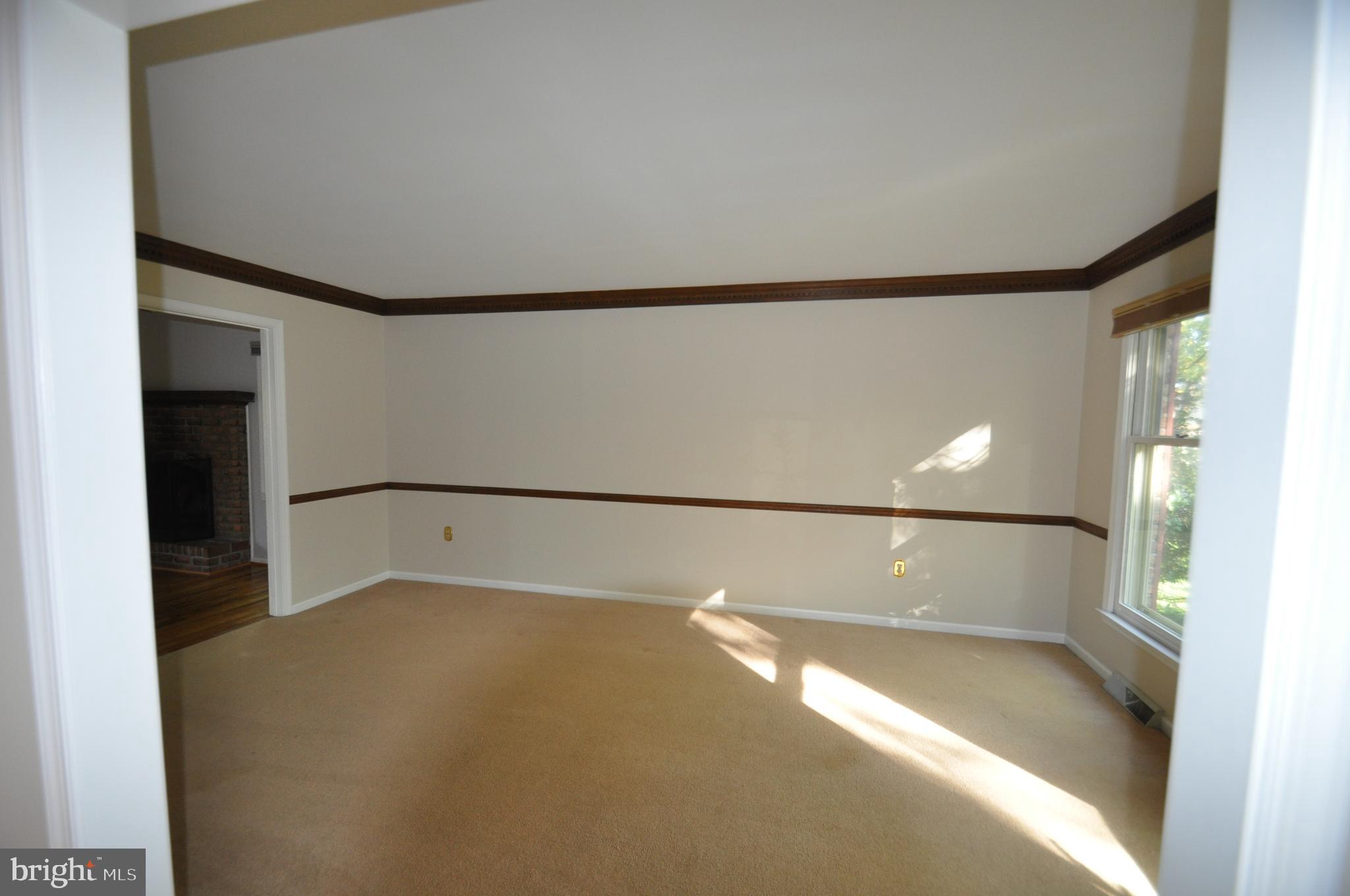 100 Country Flower Road Newark, DE 19711 - Photo 7 of 24 Nice size Living Room w/ Crown Molding & chair rai