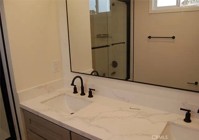 a bathroom with a sink and mirror