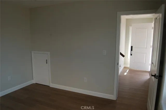 an empty room and wooden door