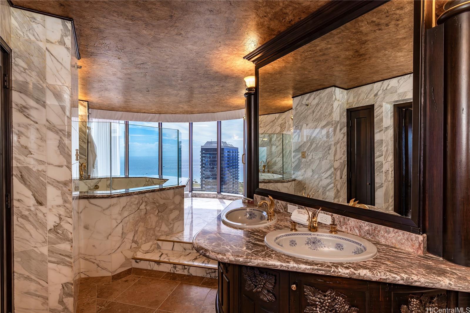 425 South Street, Unit 4501 Honolulu, HI 96813 - Photo 11 of 12 a bathroom with a granite countertop sink and a mirror