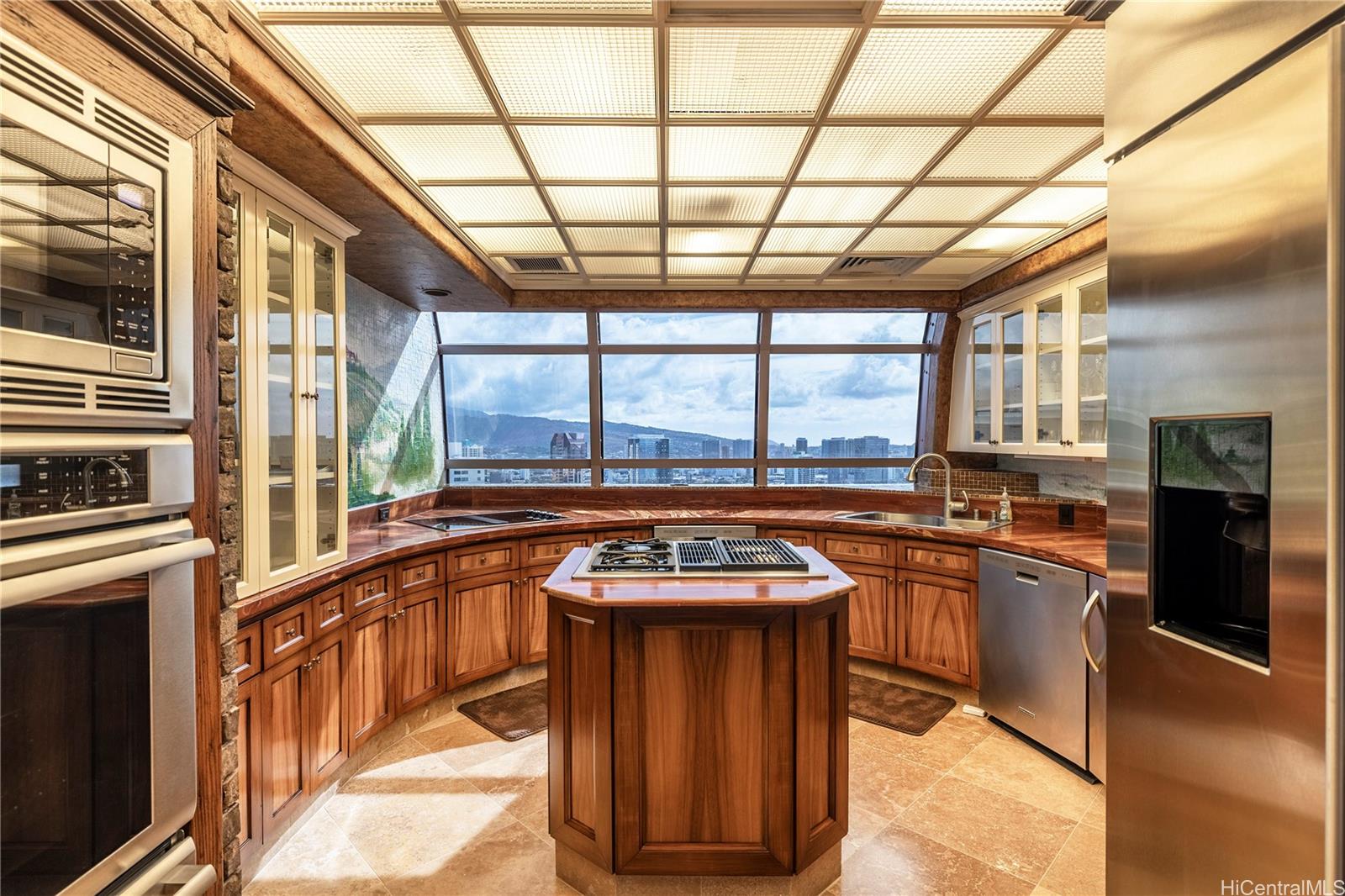 425 South Street, Unit 4501 Honolulu, HI 96813 - Photo 6 of 12 a kitchen with stainless steel appliances granite countertop a stove a sink and a refrigerator