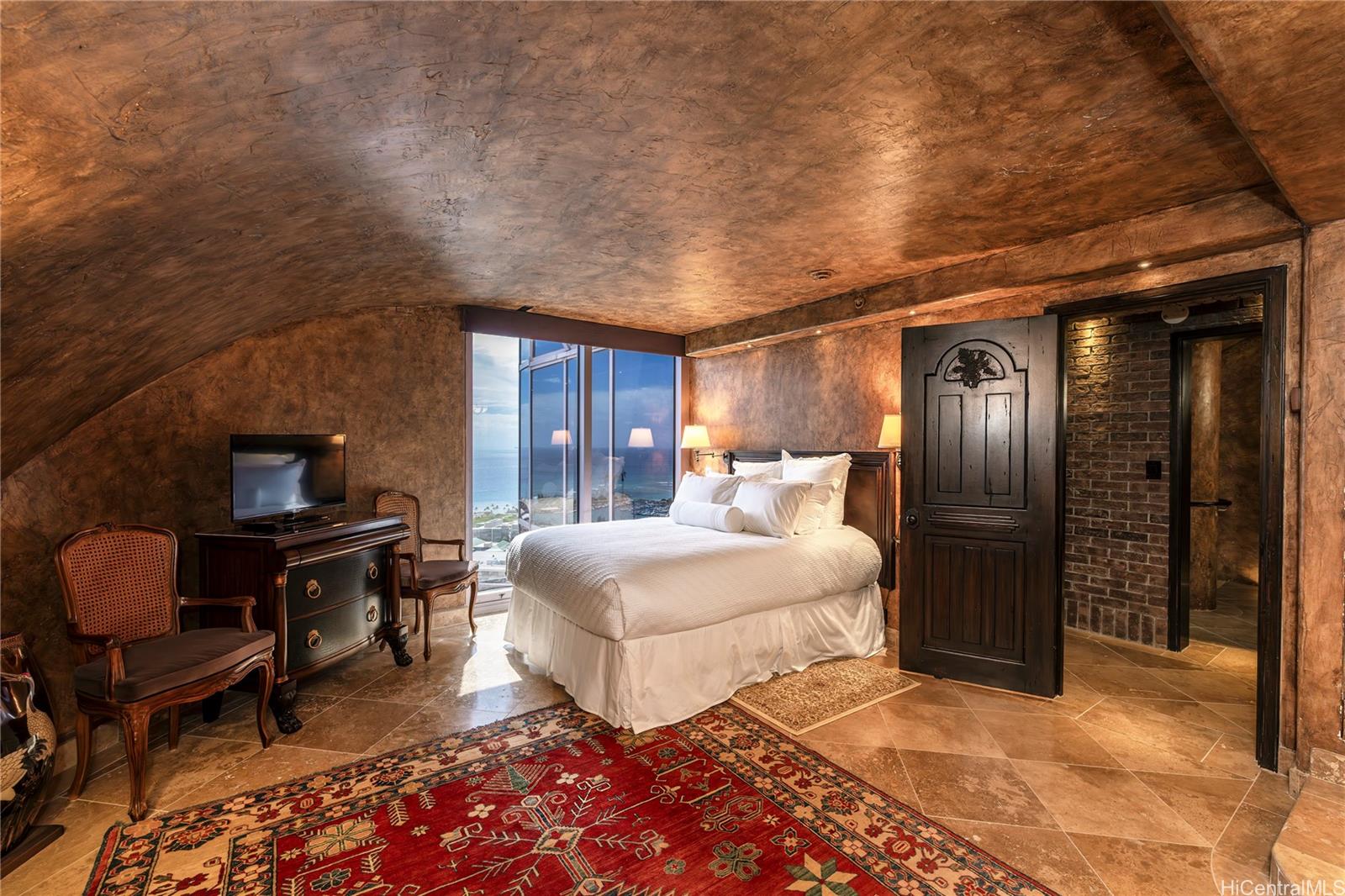 425 South Street, Unit 4501 Honolulu, HI 96813 - Photo 10 of 12 a bedroom with a bed and wooden floor