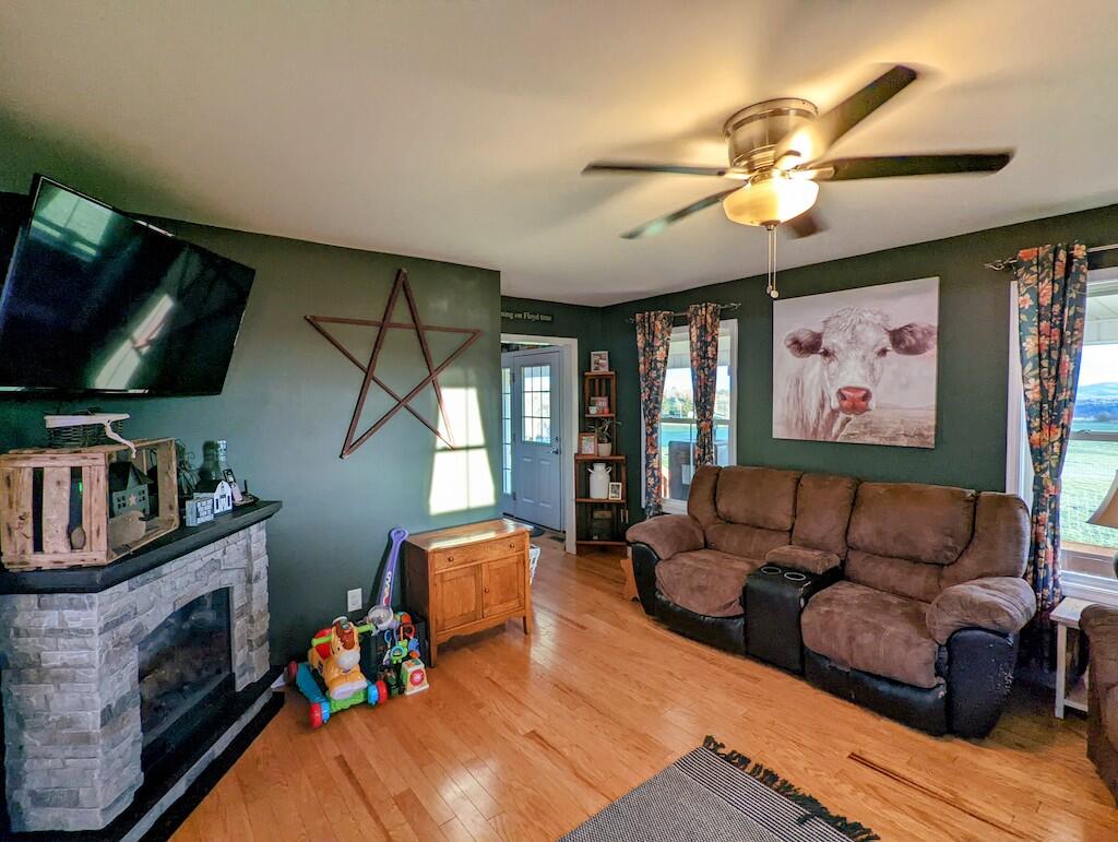 2055 Sunny Ridge Road Northeast Check, VA 24072 - Photo 13 of 35 a living room with furniture a flat screen tv and a fireplace