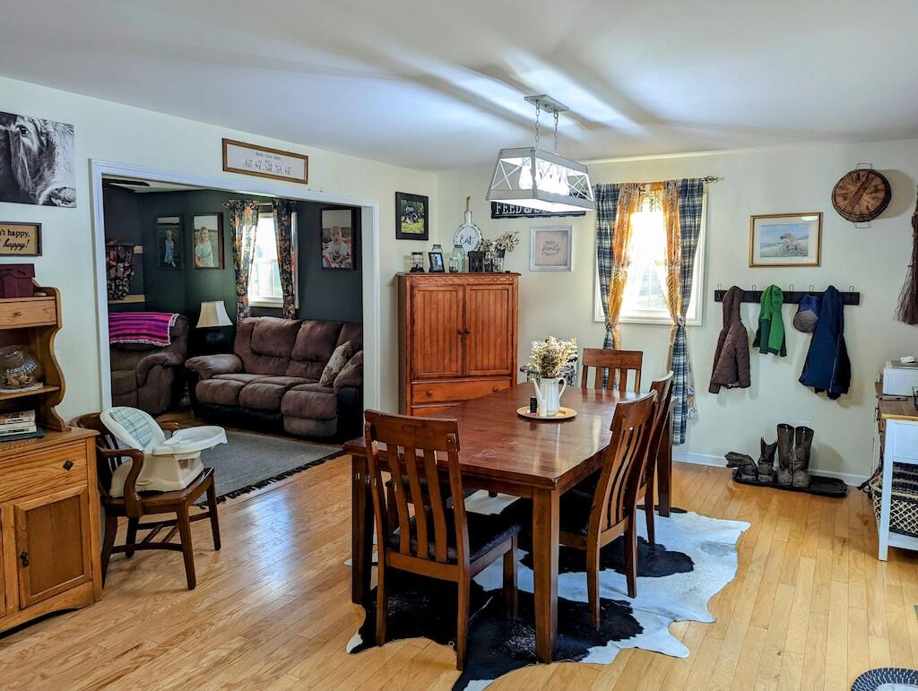 2055 Sunny Ridge Road Northeast Check, VA 24072 - Photo 6 of 35 a view of a dining room with furniture window and wooden floor