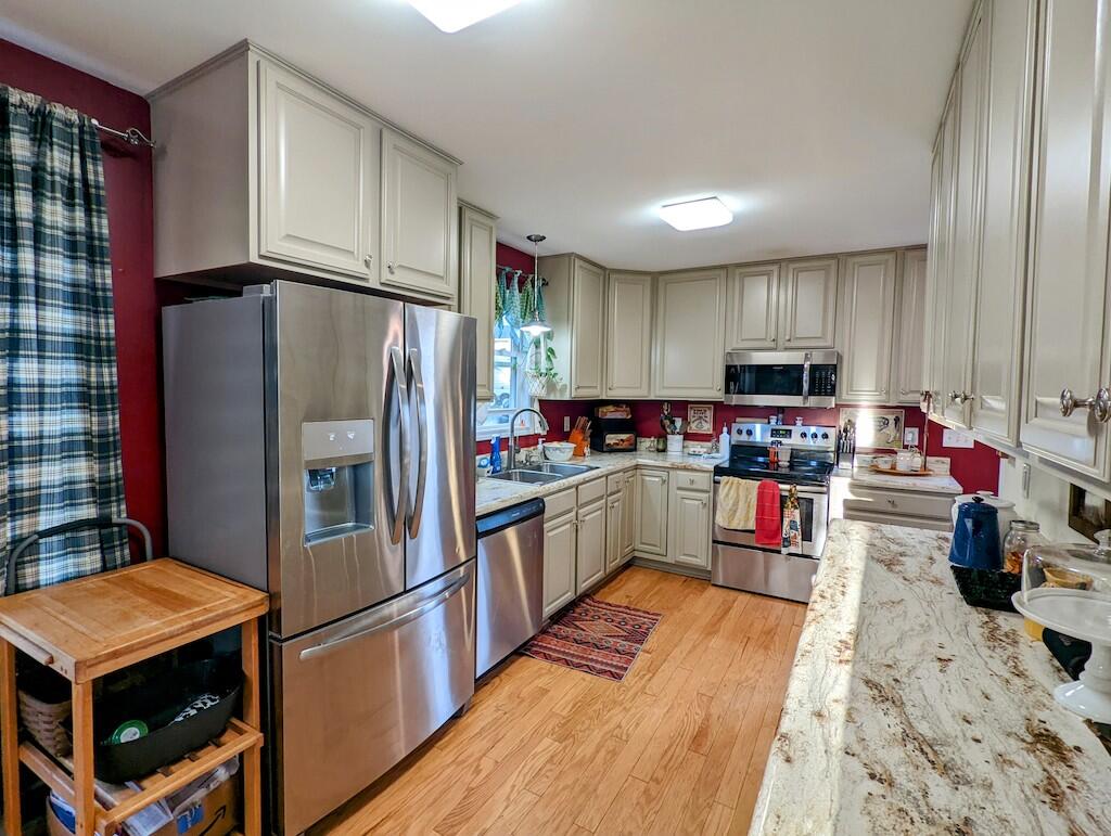 2055 Sunny Ridge Road Northeast Check, VA 24072 - Photo 9 of 35 a kitchen with stainless steel appliances kitchen island granite countertop a refrigerator and a stove top oven