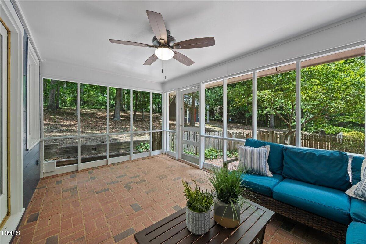6516 Bakersfield Drive Raleigh, NC 27606 - Photo 43 of 59 a living room with furniture and a large window