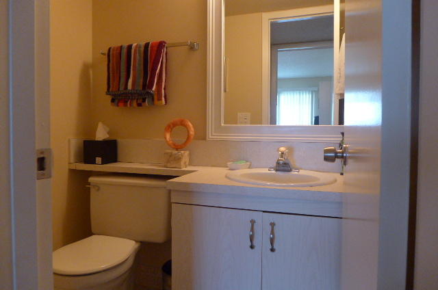 2079 Exeter Boca Raton, FL 33434 - Photo 13 of 17 a bathroom with a toilet sink and mirror