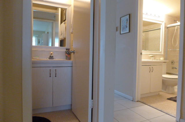 2079 Exeter Boca Raton, FL 33434 - Photo 14 of 17 a bathroom with a sink a toilet and a mirror