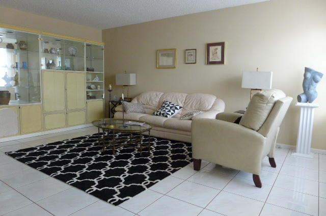 2079 Exeter Boca Raton, FL 33434 - Photo 2 of 17 a living room with a black and white checkered floor