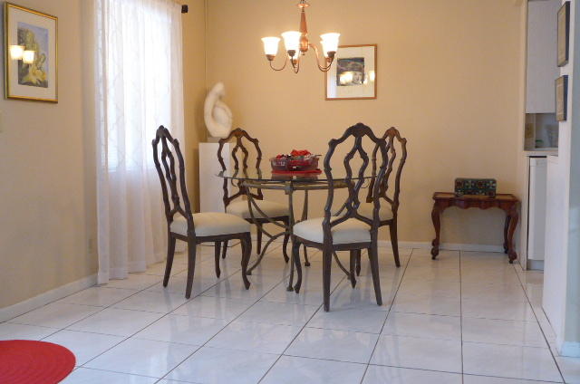 2079 Exeter Boca Raton, FL 33434 - Photo 4 of 17 a dining room with furniture and chandelier