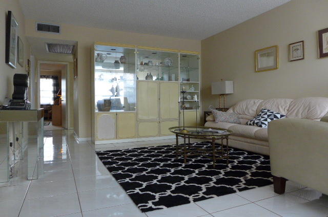 2079 Exeter Boca Raton, FL 33434 - Photo 7 of 17 a living room with a couch and a chandelier