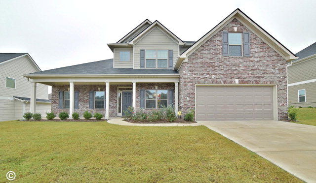 front view of a house with a yard