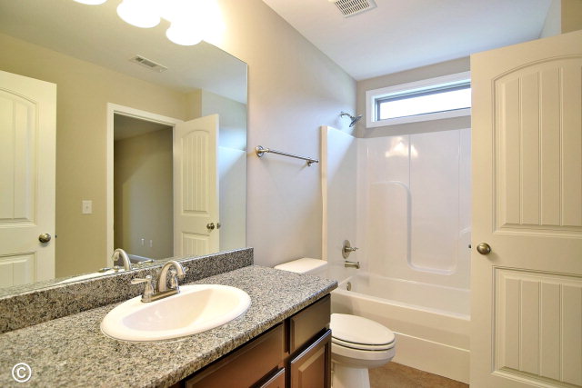 2510 Ridgewood Way Phenix City, undefined 36870 - Photo 17 of 20 a bathroom with a granite countertop sink toilet mirror and shower