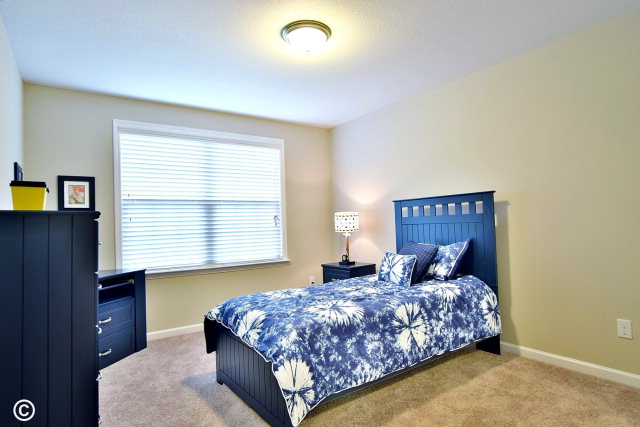 2510 Ridgewood Way Phenix City, undefined 36870 - Photo 19 of 20 a bedroom with a bed and a dresser next to a window
