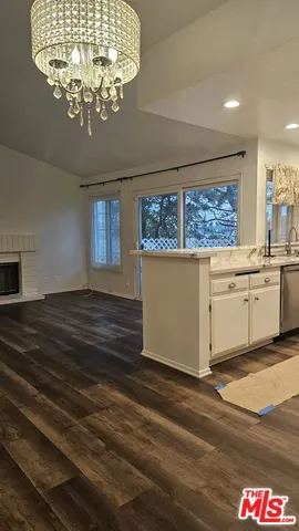 a stove top oven sitting inside of a kitchen