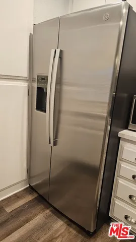 a kitchen with a sink and refrigerator