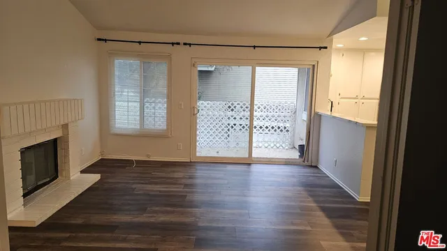 a view of a house with backyard and deck