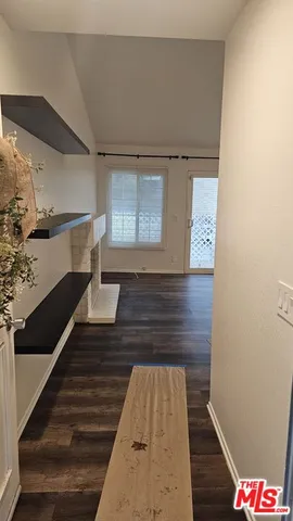 a view of a house with a tree