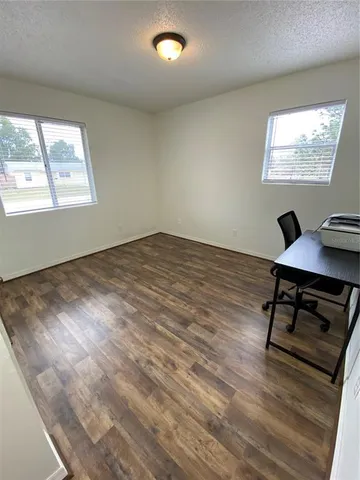 a workspace with wooden floor