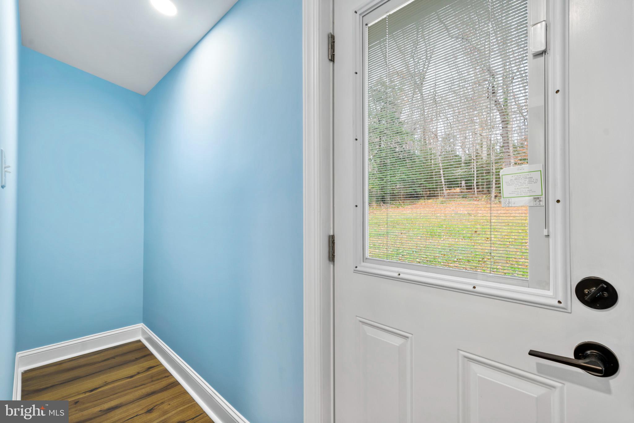 1370 Coster Road Lusby, MD 20657 - Photo 28 of 36 Backdoor and Pantry Space