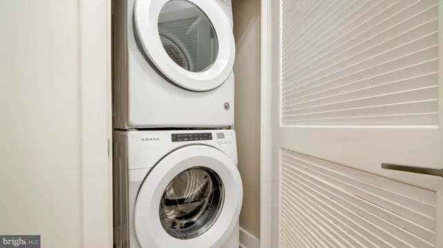 a close view of a utility room with dryer and washer
