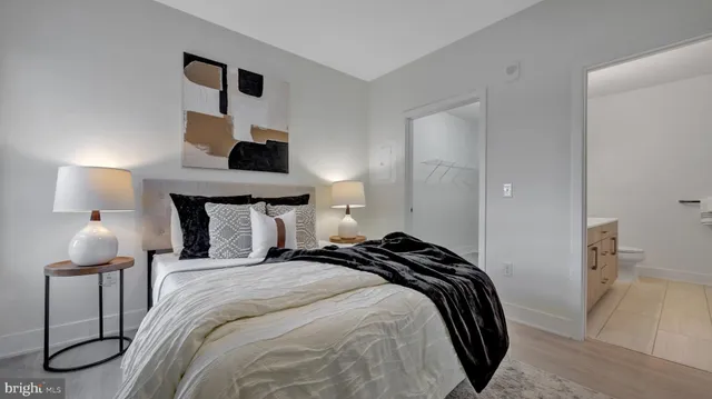 a bedroom with a bed and a lamp