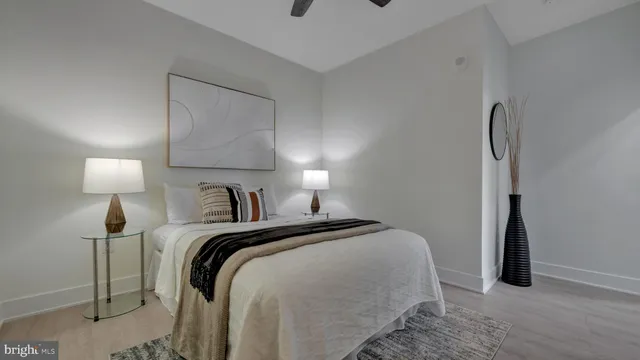 a bedroom with a bed and a lamp