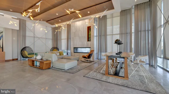 a living room with furniture a fireplace and a table