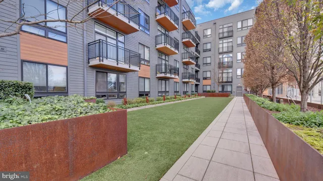 a view of a building with a yard