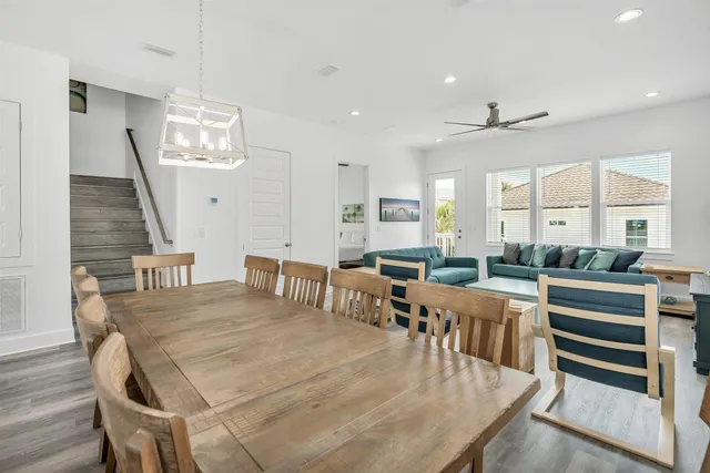 a living room with furniture a rug and a flat screen tv