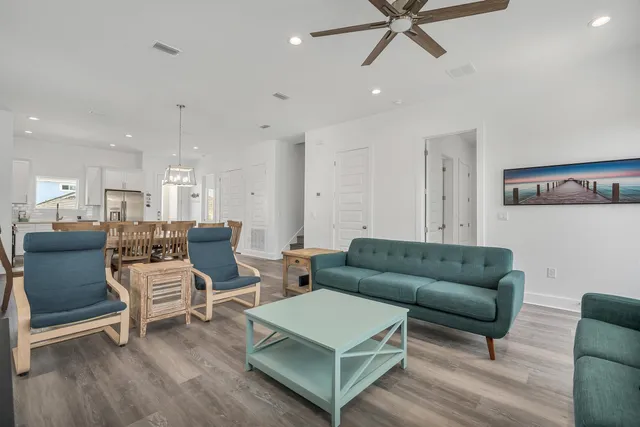 a bedroom with a bed a window and a flat screen tv