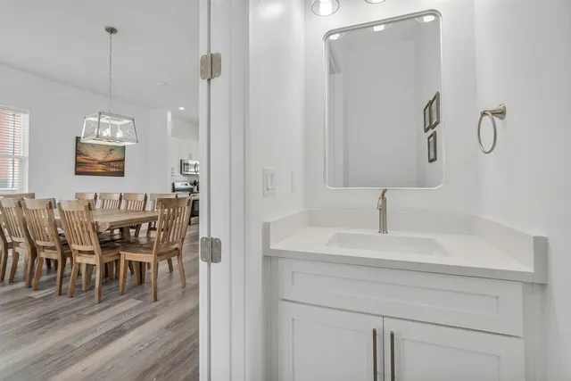 a bathroom with a sink and a mirror