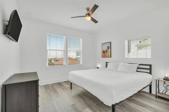 a bedroom with a bed and a television