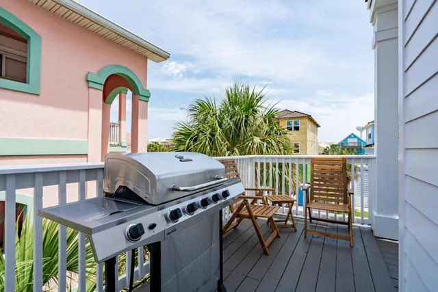 a swimming pool with outdoor seating and yard