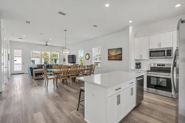 a kitchen with a stove top oven sink and cabinets