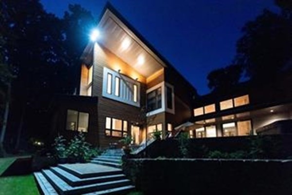 a front view of a house with a yard