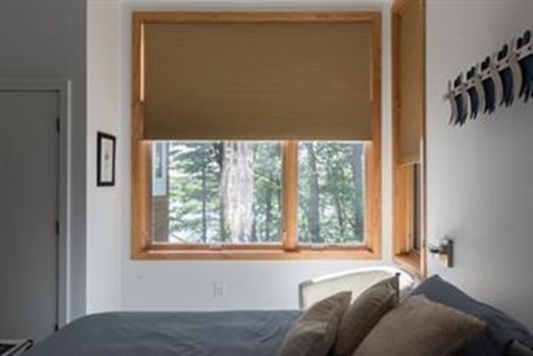 30 Arcadia Road Natick, MA 01760 - Photo 11 of 17 a living room with a bed furniture and a window