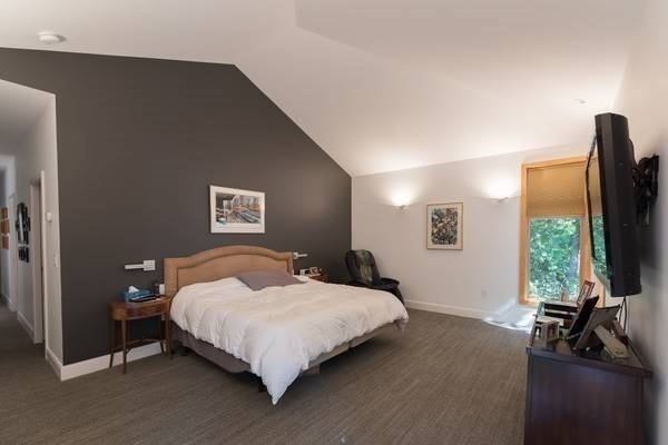 30 Arcadia Road Natick, MA 01760 - Photo 12 of 17 a bedroom with a bed and a flat screen tv