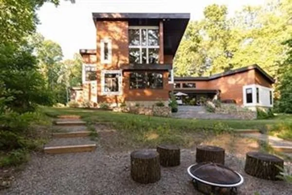 a front view of a house with garden